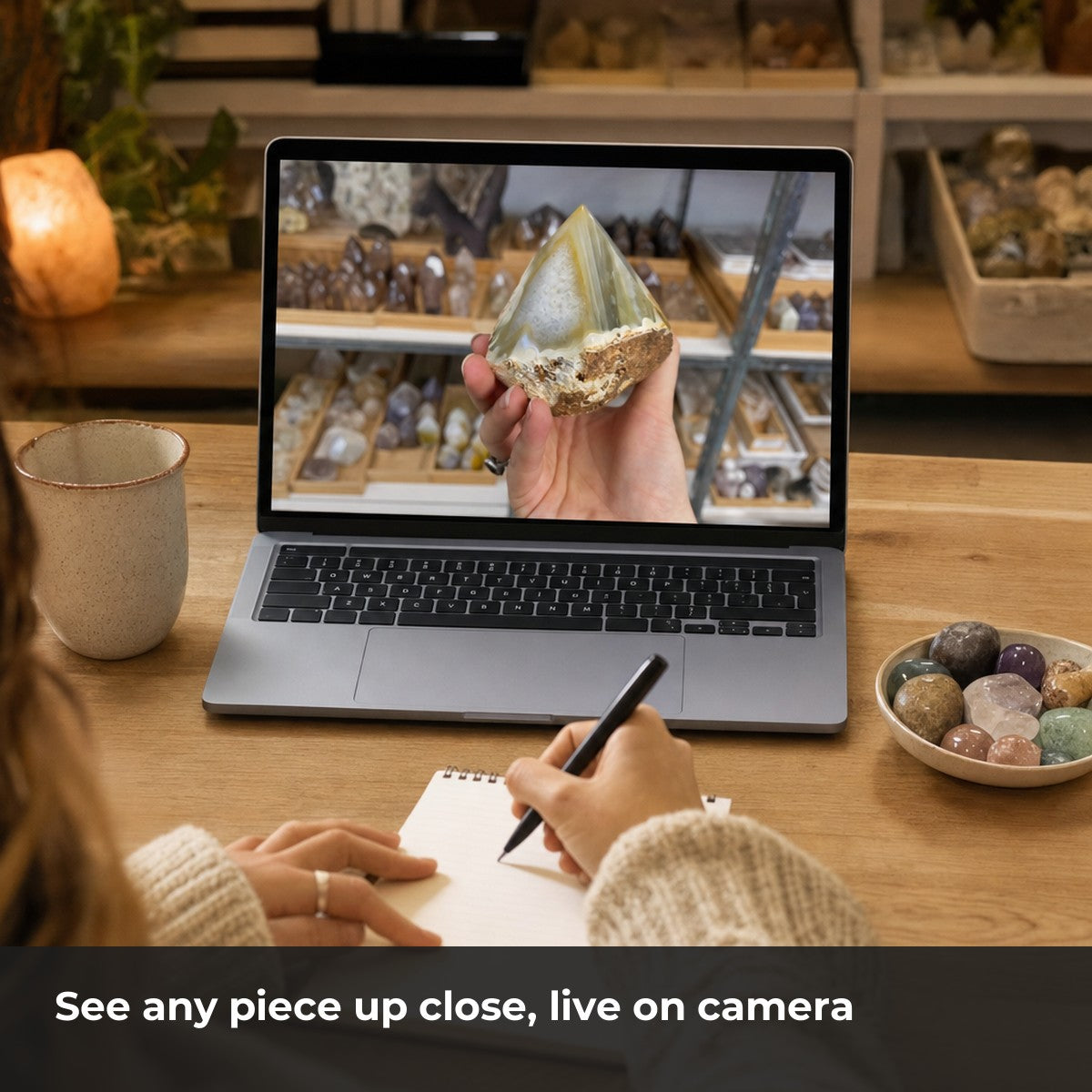 A buyer shown a polished agate point up close on a laptop video call