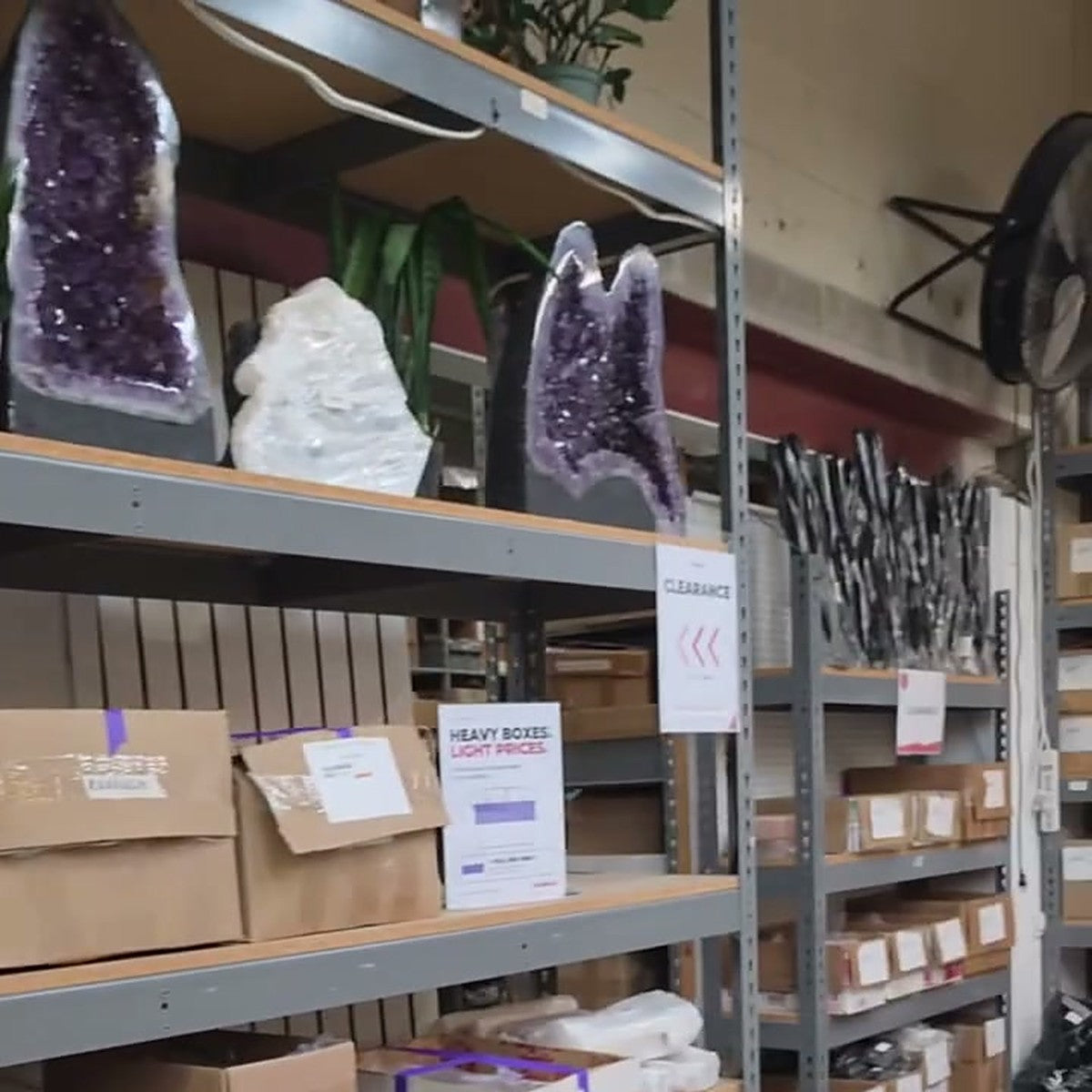 Amethyst geodes and stock boxes on the warehouse shelves