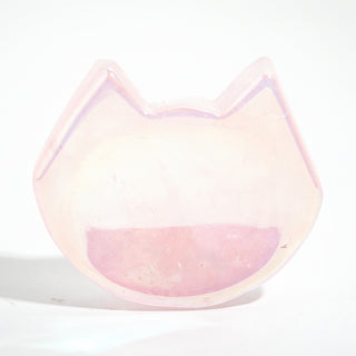 Rose Quartz Aura-Plated Cat Head Bowl, a small pink aura-plated quartz dish carved with pointed cat ears and an iridescent rim, photographed on a clean white background. Stonebridge Imports.