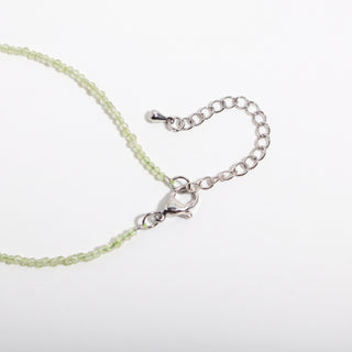 Peridot Bracelet - 2-3mm, alternate angle photographed on a clean white background. Stonebridge Imports.