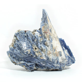 Blue Kyanite Cluster U#116 from the front, pearly blue blades and white quartz with rust-tan patches, on a clean white background. Stonebridge Imports.