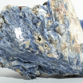 Close-up of Blue Kyanite Cluster U#116 showing the pearly cleavage faces and fine striations along the blue kyanite blades. Stonebridge Imports.