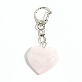 Rose Quartz Heart Charm - Pack of 5 - a single polished soft pink rose quartz heart from the pack on its silver-tone swivel clasp and keyring, photographed on a clean white background. Stonebridge Imports.