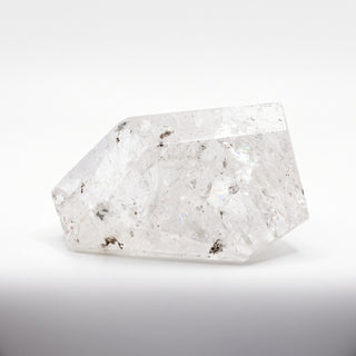 Clear Quartz Free Form Unique #1, a polished clear quartz free-form polished point shown from an alternate angle on a clean white background. Stonebridge Imports.