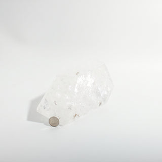 Clear Quartz Free Form Unique #1, a polished clear quartz free-form polished point shown from an alternate angle on a clean white background. Stonebridge Imports.