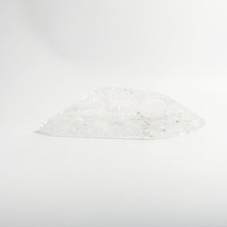 Clear Quartz Free Form Unique #2, a polished clear quartz free-form polished point shown from an alternate angle on a clean white background. Stonebridge Imports.