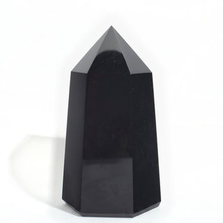 Black Obsidian Generator Unique #3 — polished six-sided tower with a faceted point, seen from a second angle, photographed on a clean white background. Stonebridge Imports.