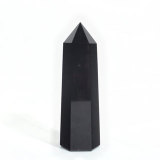 Black Obsidian Generator Unique #9 — polished six-sided tower with a faceted point, seen from a second angle, photographed on a clean white background. Stonebridge Imports.