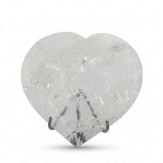 Clear Quartz Heart on Stand Unique #2, a polished clear quartz heart on a silver metal stand shown from an alternate angle on a clean white background. Stonebridge Imports.