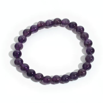 Quiet Mind: deep purple amethyst 8mm bead stretch bracelet from the Intention Bracelet Display Kit, on a clean white background. Stonebridge Imports.