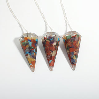 Chakra Orgone Pendulum 6 Facet & Bead - 3 Pack, three multicoloured chakra orgone pendulums hanging side by side on a clean white background. Stonebridge Imports.