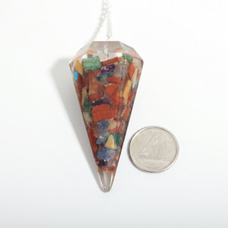 Chakra Orgone Pendulum 6 Facet & Bead - 3 Pack, one multicoloured chakra orgone pendulum beside a dime for scale, on a clean white background. Stonebridge Imports.