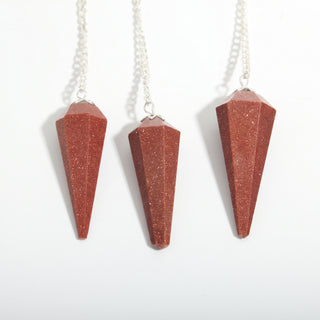 Brown Goldstone Pendulum 6 Facet & Bead - 3 Pack, three red-brown sparkling goldstone pendulums hanging side by side on a clean white background. Stonebridge Imports.