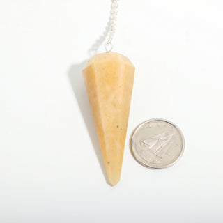 Golden Quartz Pendulum 6 Facet & Bead - 3 Pack, one yellow to amber golden quartz pendulum beside a dime for scale, on a clean white background. Stonebridge Imports.