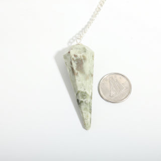 Vessonite Pendulum 6 Facet & Bead - 3 Pack, one mottled green vessonite pendulum beside a dime for scale, on a clean white background. Stonebridge Imports.