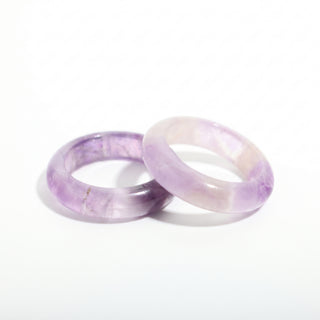 Amethyst Ring — solid translucent purple amethyst stone band ring, photographed on a clean white background. Stonebridge Imports.