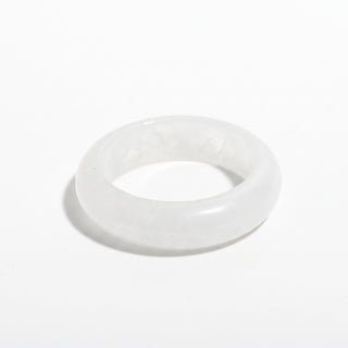 Clear Quartz Ring — solid clear quartz stone band ring, alternate angle photographed on a clean white background. Stonebridge Imports.