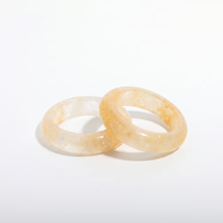 Golden Healer Ring — solid pale golden healer quartz stone band ring, photographed on a clean white background. Stonebridge Imports.