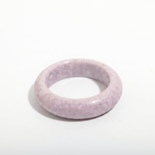 Lepidolite Ring - Size 8 — solid lilac-and-grey speckled lepidolite stone band ring, alternate angle photographed on a clean white background. Stonebridge Imports.