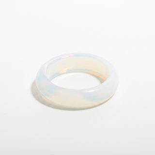 Opalite Ring — solid milky blue-white opalite stone band ring, alternate angle photographed on a clean white background. Stonebridge Imports.