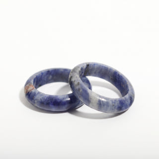 Sodalite Ring — solid royal-blue sodalite with white veining stone band ring, photographed on a clean white background. Stonebridge Imports.