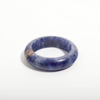 Sodalite Ring — solid royal-blue sodalite with white veining stone band ring, alternate angle photographed on a clean white background. Stonebridge Imports.