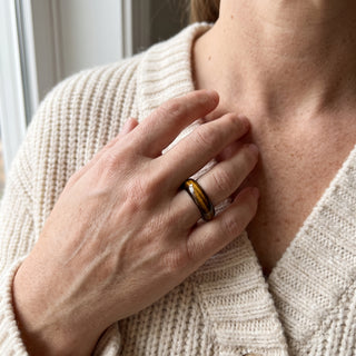 Tiger Eye Ring worn on the hand in natural light, showing the solid golden-brown banded tiger eye band at true scale.