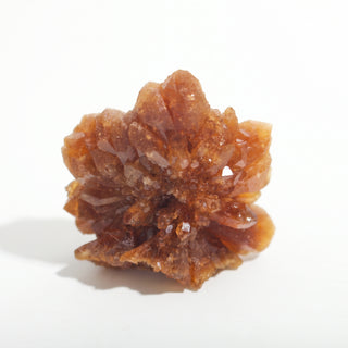 1 1/2" — Natural Citrine - Morocco, a honey-amber crystal cluster rosette of small pointed crystals with translucent golden tips, photographed on a clean white background. Stonebridge Imports.