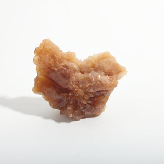 1 1/2" — Natural Citrine - Morocco, a fan-shaped cluster of honey-coloured crystal blades on a pale tan base, photographed on a clean white background. Stonebridge Imports.