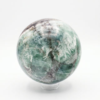 Fluorite Green and Purple Sphere Unique #9, alternate angle showing translucent sea-green fluorite with white and grey veining, on a clean white background. Stonebridge Imports.