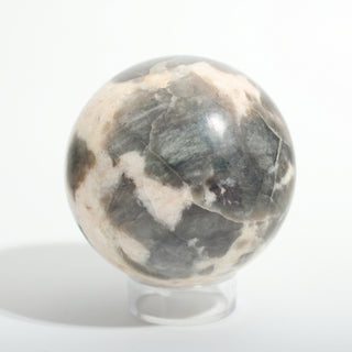 Small #2 — Chocolate Labradorite Sphere, cream stone with smoky brown-grey labradorite patches with grey-blue labradorite flash, photographed on a clean white background. Stonebridge Imports.