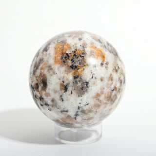 Small #2 — Chocolate Labradorite Sphere, cream stone with smoky brown-grey labradorite patches, speckled reverse side, photographed on a clean white background. Stonebridge Imports.