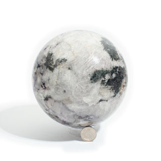 Black Tourmaline and Smoky Quartz Sphere Unique #1, cloudy white and smoky grey quartz patched with black tourmaline, photographed on a clean white background. Stonebridge Imports.
