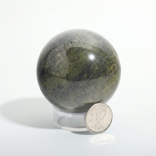 Small #1 — Vessonite Sphere, deep olive green with lighter green and gold veining beside a Canadian dime for scale, photographed on a clean white background. Stonebridge Imports.