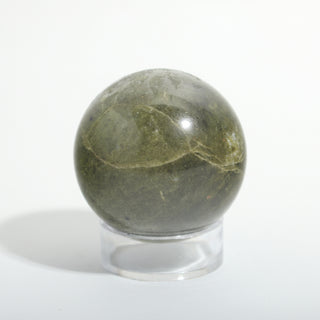 Extra Small #2 — Vessonite Sphere, deep olive green with lighter green and gold veining, photographed on a clean white background. Stonebridge Imports.