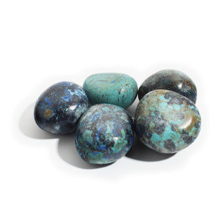 Large — Azurite Tumbled Stones, five dark navy stones speckled with royal-blue azurite and teal-turquoise patches, one mostly teal, photographed on a clean white background. Stonebridge Imports.