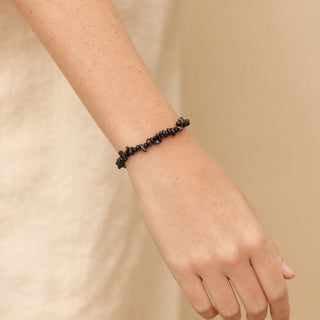 Black Agate bead bracelet worn on the wrist, close-up