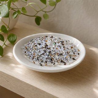 Blue Lace Agate Extra Tiny Tumbled Stones - B Quality in a stoneware dish on a shop shelf