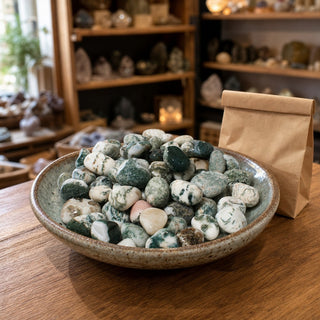 Green Tree Agate Tumbled Stones - India in a ceramic bowl on a shop counter