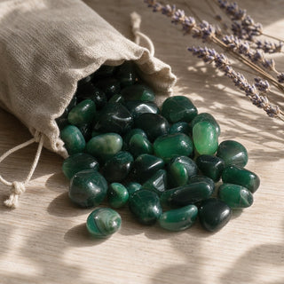 Agate Green Tumbled Stones (Enhanced) spilling from a linen pouch
