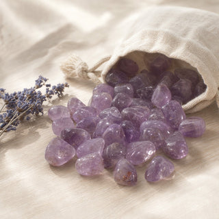 Amethyst A Tumbled Stones spilling from a linen pouch