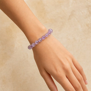 Light Amethyst bead bracelet worn on the wrist, close-up