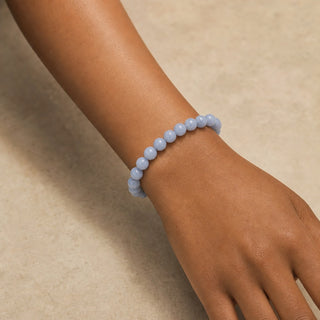 Angelite bead bracelet worn on the wrist, close-up