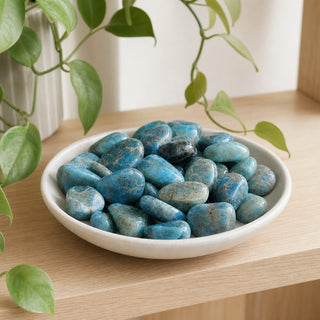 Apatite Blue Tumbled Stones in a stoneware dish on a shop shelf