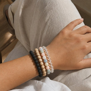 Aquamarine & Morganite bead bracelet stacked with other bead bracelets on the wrist