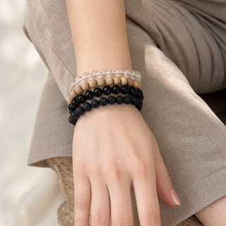 Black Tourmaline bead bracelet stacked with other bead bracelets on the wrist