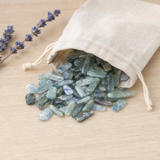 Blue Kyanite Blade Tumbled spilling from a linen pouch