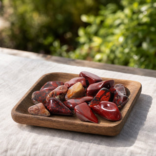 Brecciated Jasper Tumbled Stones in a wooden tray at a market stall