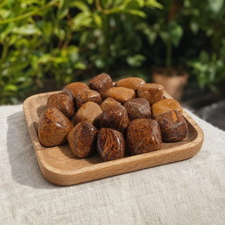 Calligraphy Jasper (Miriam Stone) Tumbled Stones in a wooden tray at a market stall