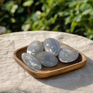 Celestite B Tumbled Stones displayed in a shop